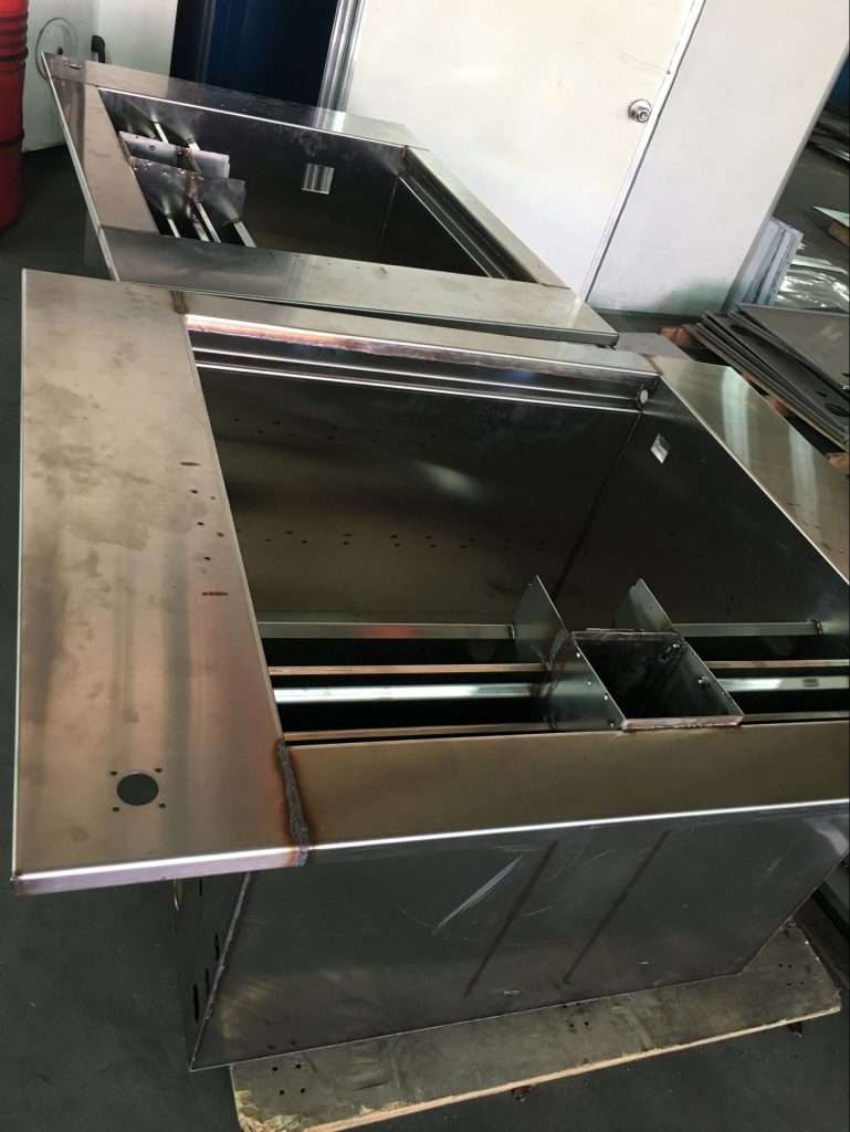 Fabricated metal product: Welded semi-finished stainless steel outer shell of an ultrasonic cleaning machine with a focus on high-quality welding and passivation treatment